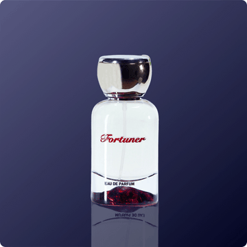 Perfume bottle labeled 'Fortuner' on a dark blue background