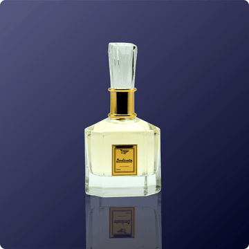 Clear perfume bottle with gold cap on a dark blue background