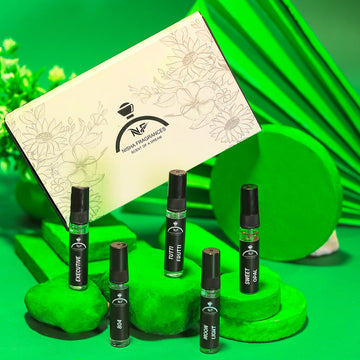 Set of small bottles with a green background and a branded box.