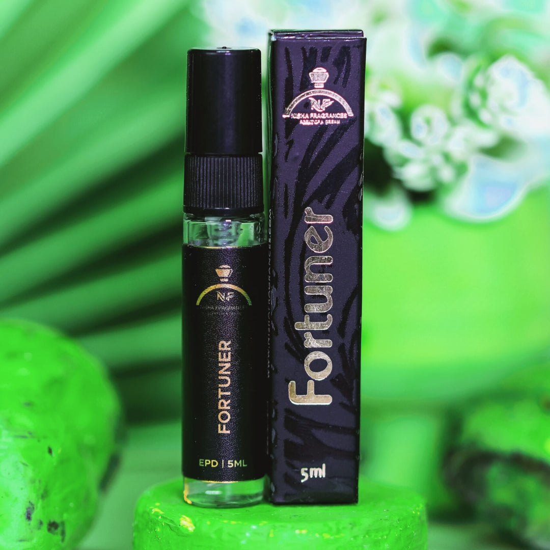 GreenFortuner perfume bottle on a dark blue background