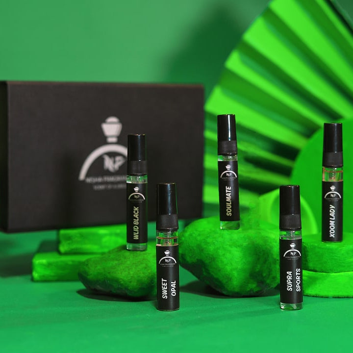 Open black box containing ampoules on a green background