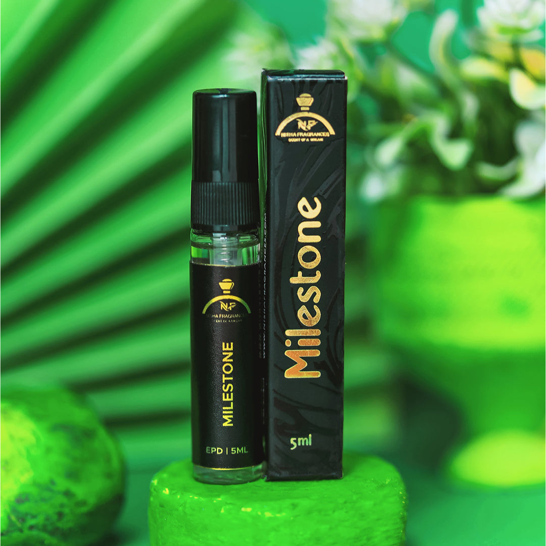 Milestone vape pen and packaging on a green background with plants