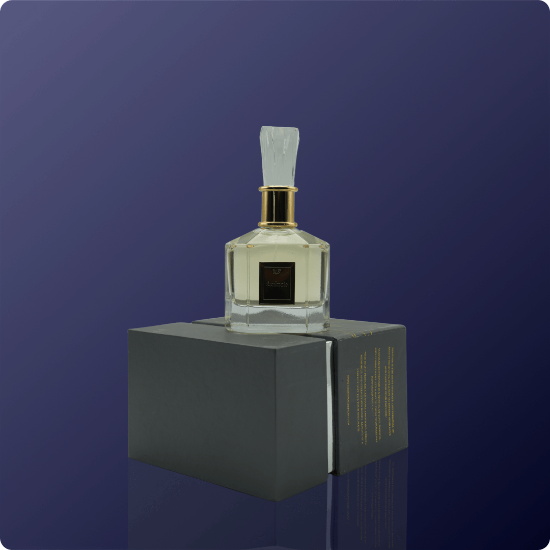 Clear perfume bottle with gold cap on a dark blue background